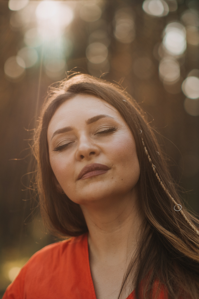 Peace of mind, breathing fresh air. Alone woman in red dress